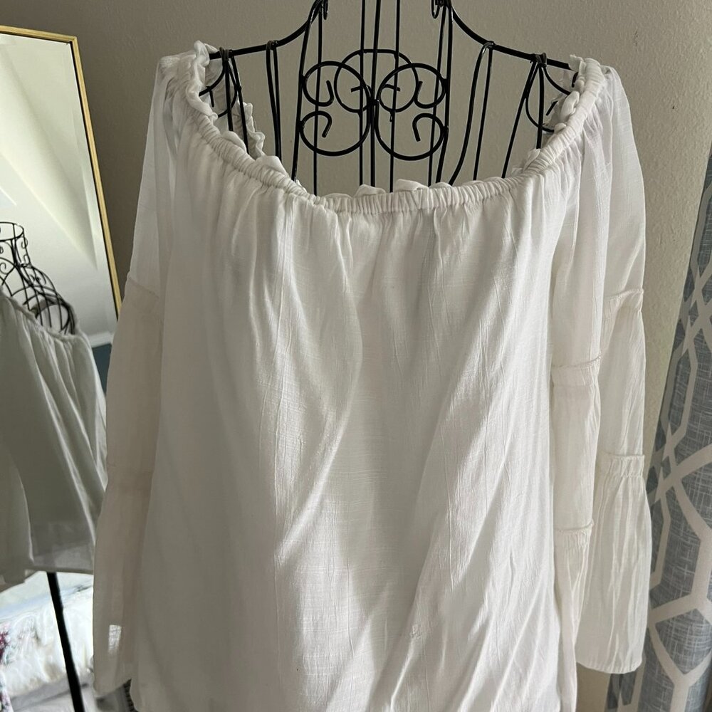 White ruffle off shoulder blouse with bell sleeves